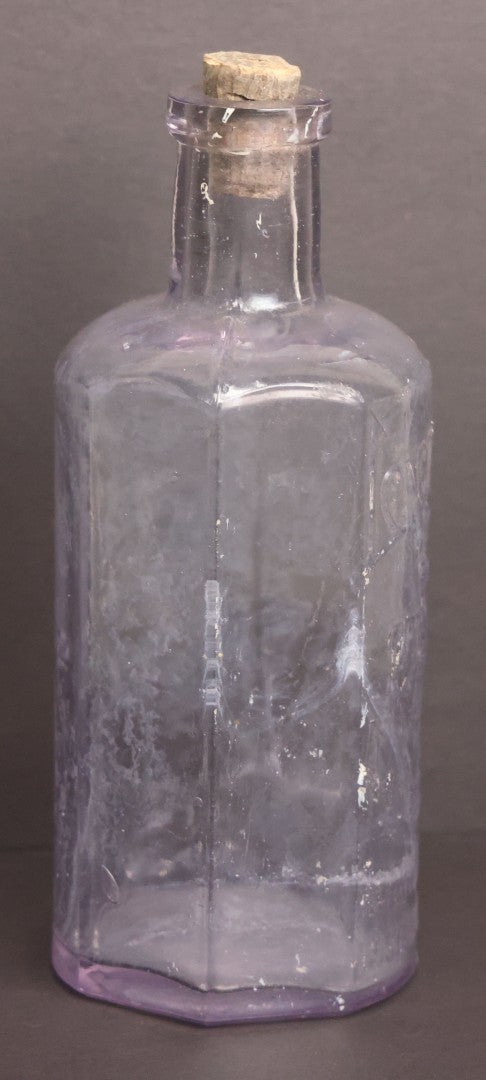 Lot 051 - Antique "Lactart" Acid Of Milk Purple Glass Medicine Bottle, Avery Lactate Co., Boston, Massachusetts, With Milkmaid And Cow Graphics