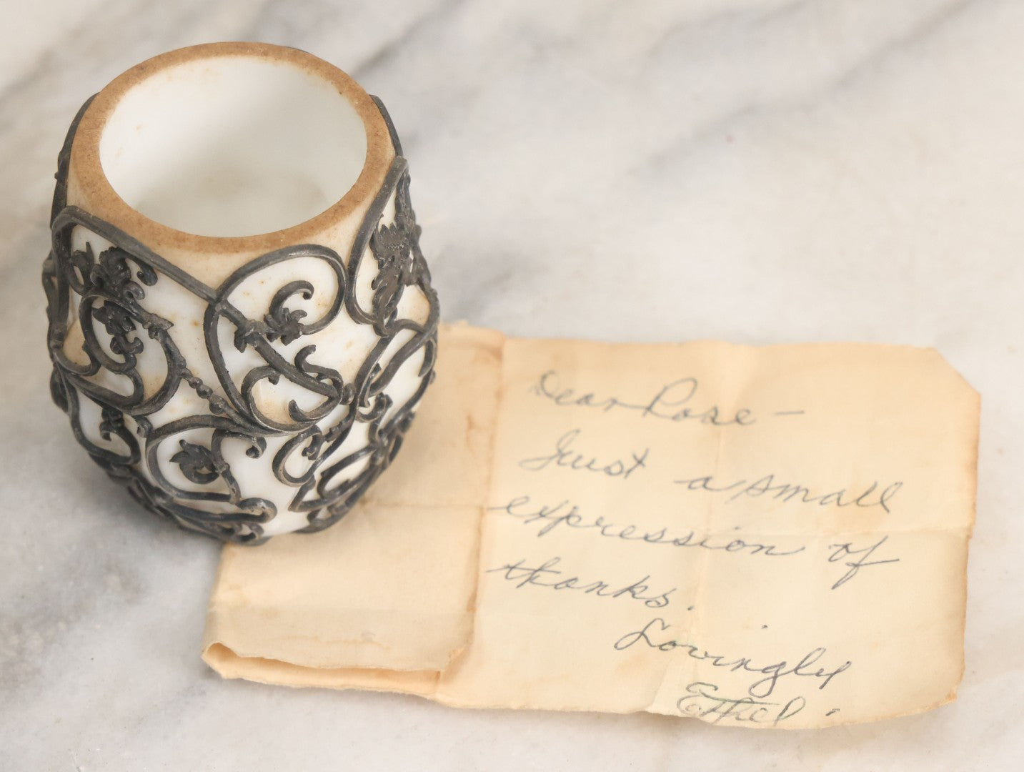 Lot 061 - Antique Milk Glass Toothpick Holder With Fancy Metal Cage Overlay, Including Paper Note, "A Small Expression Of Thanks" From Ethel To Rose, As Found
