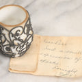 Lot 061 - Antique Milk Glass Toothpick Holder With Fancy Metal Cage Overlay, Including Paper Note, "A Small Expression Of Thanks" From Ethel To Rose, As Found