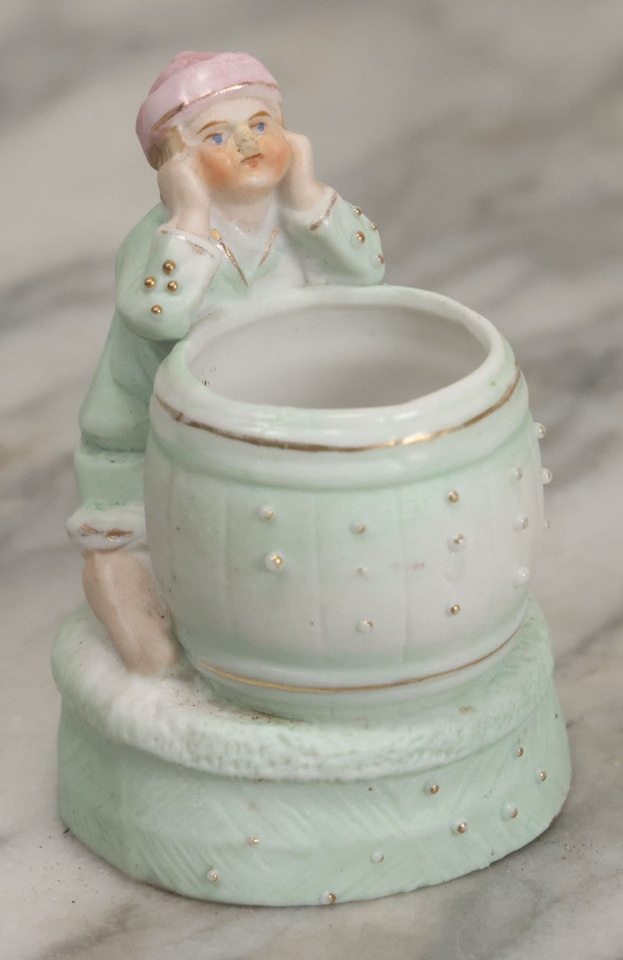Lot 062 - Antique Bisque Toothpick Holder With Little Boy In Pink Hat Leaning On Barrel, Likely Made In Germany, Marked No. 2359