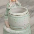 Lot 062 - Antique Bisque Toothpick Holder With Little Boy In Pink Hat Leaning On Barrel, Likely Made In Germany, Marked No. 2359