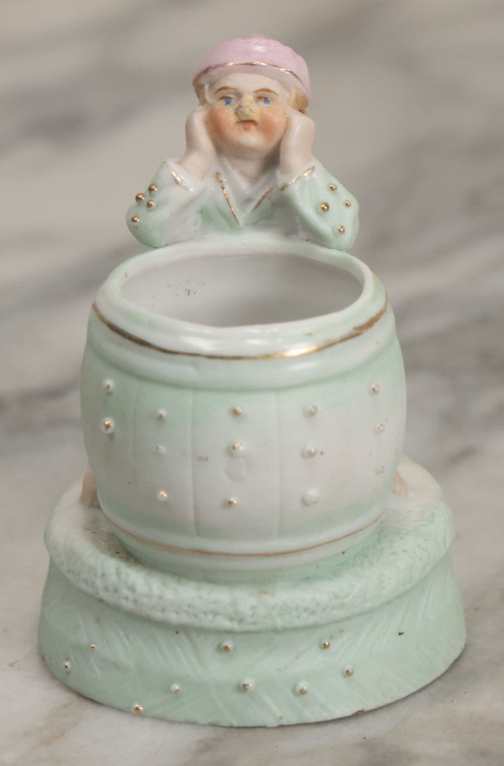 Lot 062 - Antique Bisque Toothpick Holder With Little Boy In Pink Hat Leaning On Barrel, Likely Made In Germany, Marked No. 2359