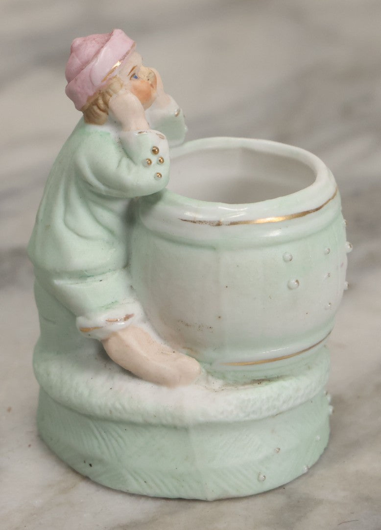 Lot 062 - Antique Bisque Toothpick Holder With Little Boy In Pink Hat Leaning On Barrel, Likely Made In Germany, Marked No. 2359
