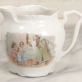 Lot 065 - Antique Porcelain Cream Pitcher With Christmas Theme, Santa Claus In Green Greeting Children With Presents, Likely Made In Germany, Unmarked
