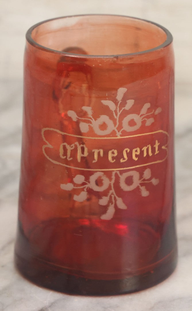 Lot 066 - Antique Ruby Glass Mug With Hand Etched, Hand Painted Details, "A Present" With Flowers, Note Chip To Bottom Of Handle, Rim