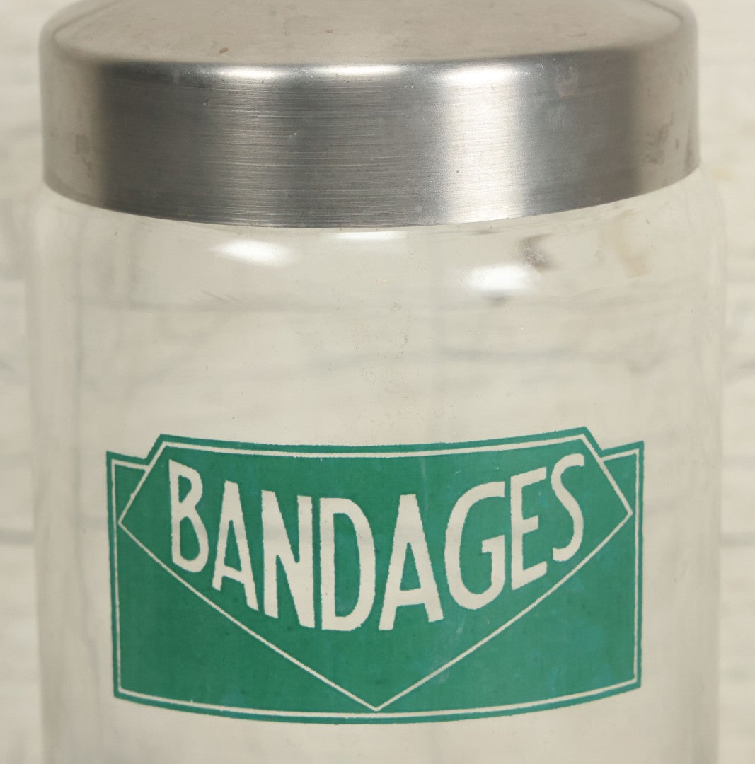 Lot 071 - Vintage Medical Doctors Office Bandages Glass Jar With Green Label And Lid, Manufactured By Profex, U.S.A.