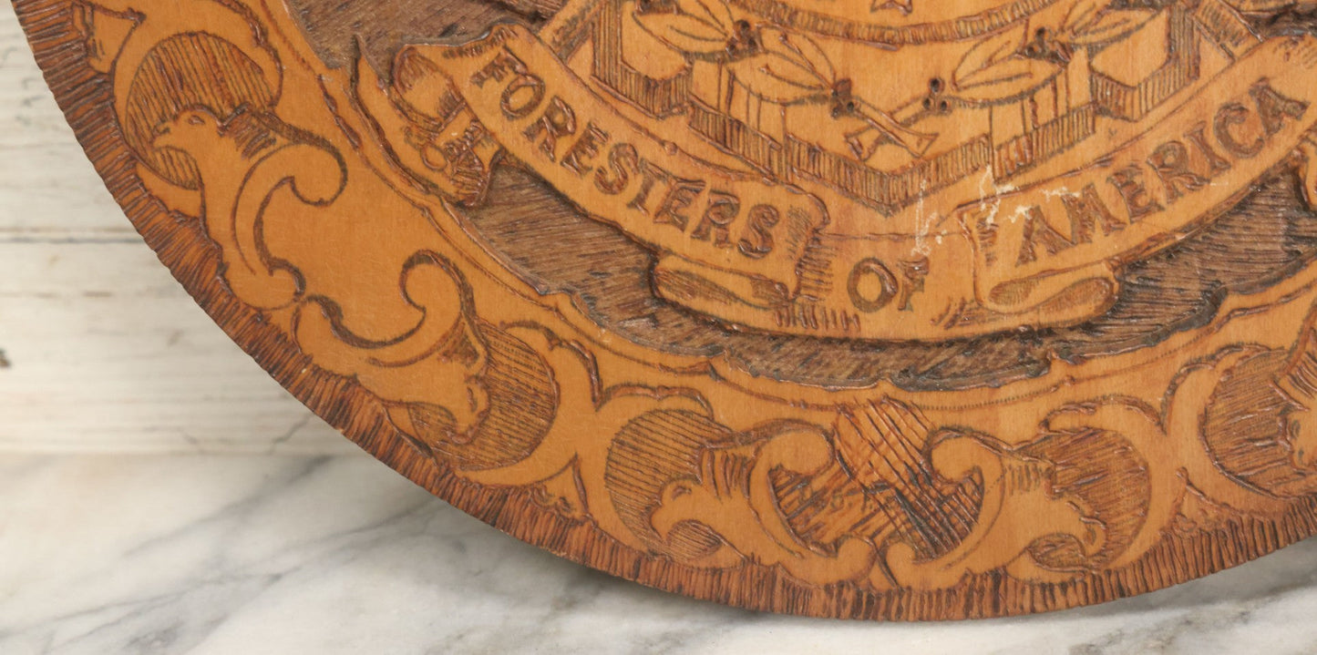 Lot 076 - Antique Wood Burned Pyrography Wall Hanging Plaque For The Foresters Of America, Fraternal Order, With Eagle And American Flags, Flemish Art Co., New York, No. 854, 14-3/4" Diameter