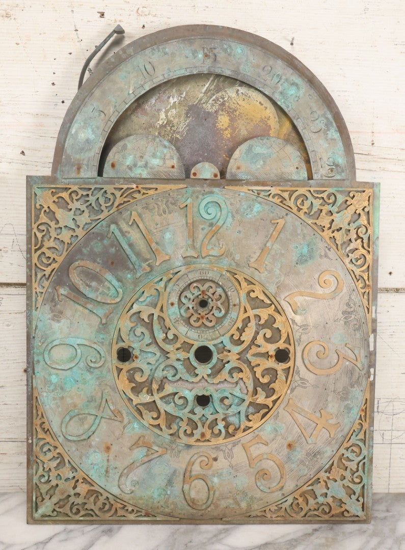 Lot 007 - Antique Brass Clock Face With Hand Painted Details Including Moon, Sun, Ships At Sea, And Buildings On Land, Manufactured By S.D. Neil, Belfast, Ireland, Dated 1896, Note Heavy Wear And Patina, 13" x 18-1/2"