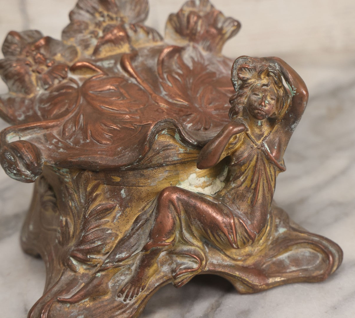 Lot 010 - Antique Art Nouveau Pot Metal Jewelry Casket With Figural Girl In Gown, Floral Motif, Tufted Red Interior, Bottom Marked M.R., Note Hinge Broken, Torn Fabric