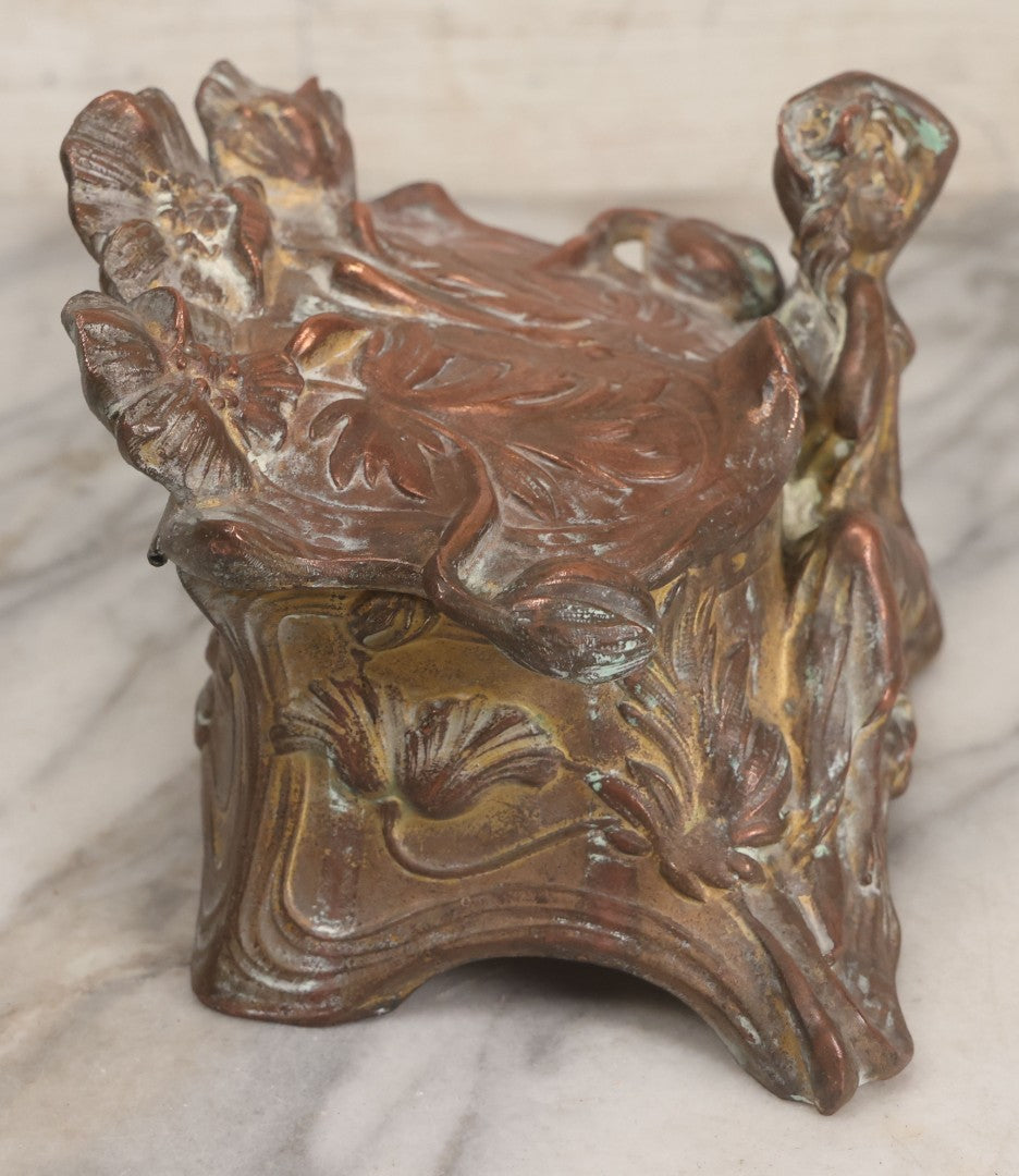 Lot 010 - Antique Art Nouveau Pot Metal Jewelry Casket With Figural Girl In Gown, Floral Motif, Tufted Red Interior, Bottom Marked M.R., Note Hinge Broken, Torn Fabric