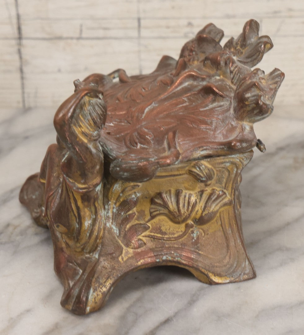 Lot 010 - Antique Art Nouveau Pot Metal Jewelry Casket With Figural Girl In Gown, Floral Motif, Tufted Red Interior, Bottom Marked M.R., Note Hinge Broken, Torn Fabric