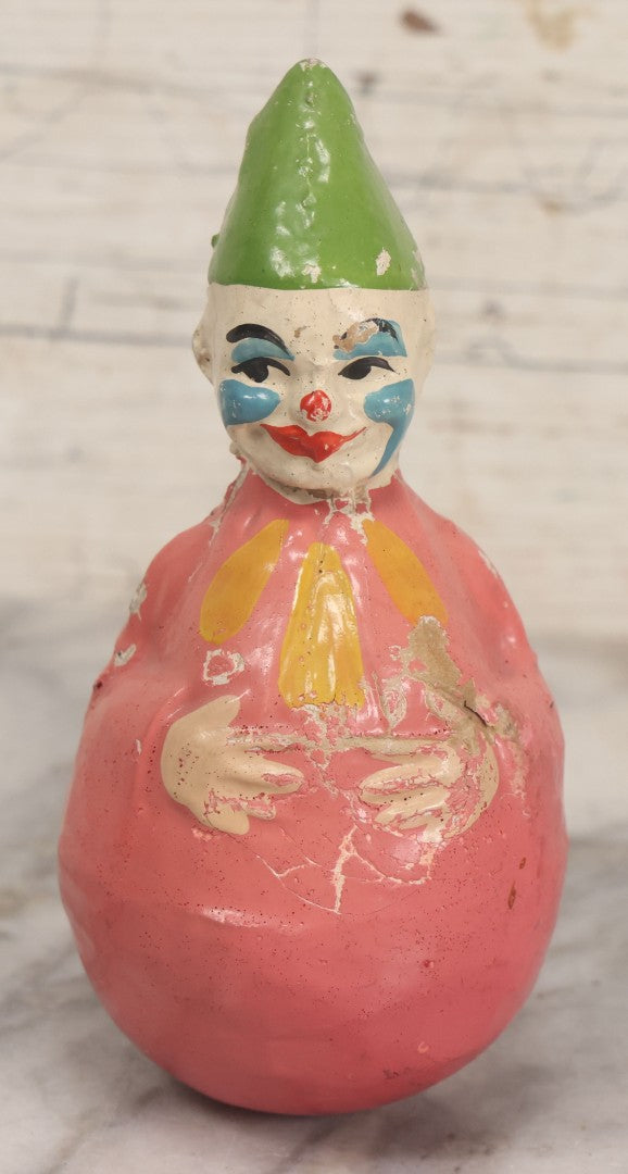 Lot 013 - Antique Papier Mache Clown Roly Poly Toy With Pink Body, Blue Makeup And Green Hat, Note Wear And Tear Throughout, Height 6"