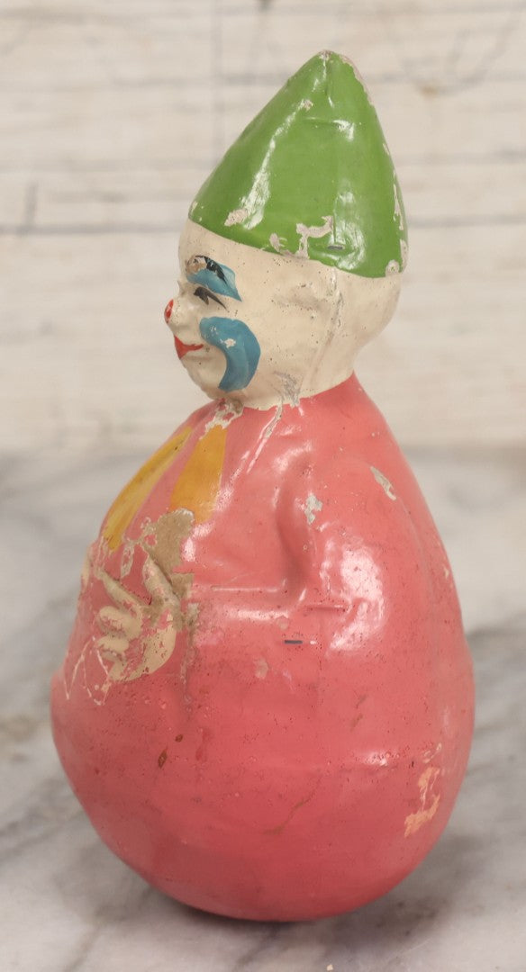 Lot 013 - Antique Papier Mache Clown Roly Poly Toy With Pink Body, Blue Makeup And Green Hat, Note Wear And Tear Throughout, Height 6"