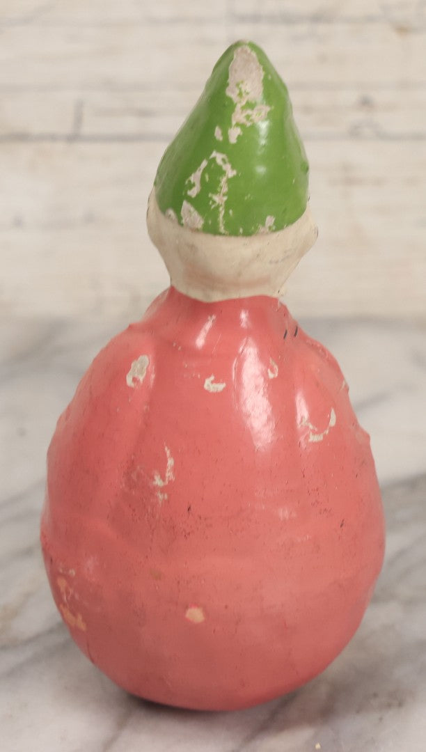Lot 013 - Antique Papier Mache Clown Roly Poly Toy With Pink Body, Blue Makeup And Green Hat, Note Wear And Tear Throughout, Height 6"