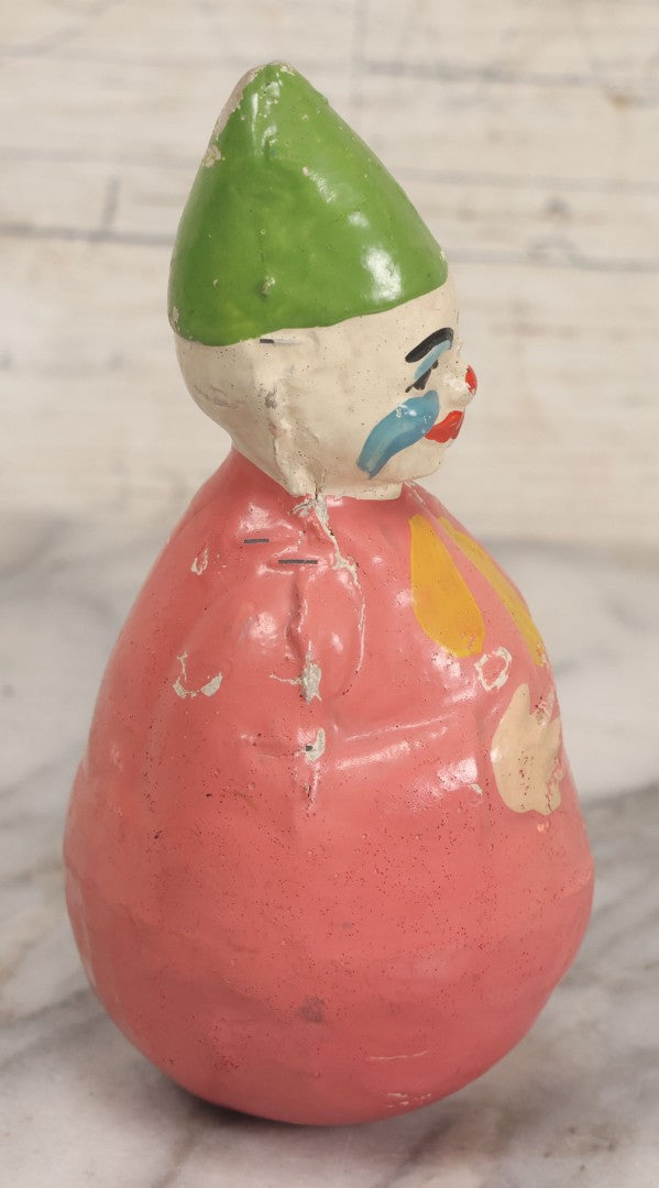 Lot 013 - Antique Papier Mache Clown Roly Poly Toy With Pink Body, Blue Makeup And Green Hat, Note Wear And Tear Throughout, Height 6"