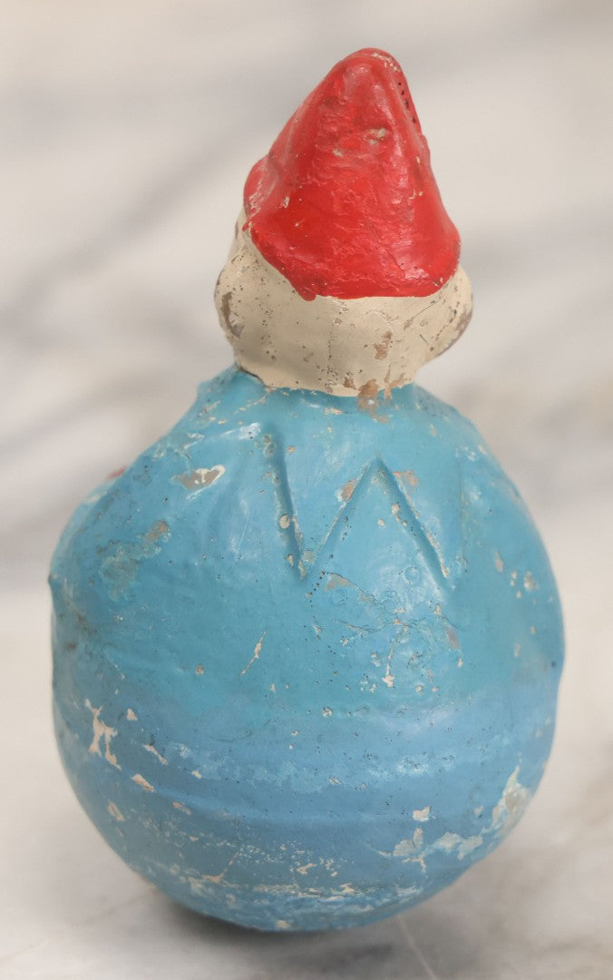 Lot 014 - Antique Papier Mache Clown Roly Poly Toy With Blue Body, Green And Yellow Makeup And Red Hat, Note Wear And Tear Throughout, Height 3-3/4"
