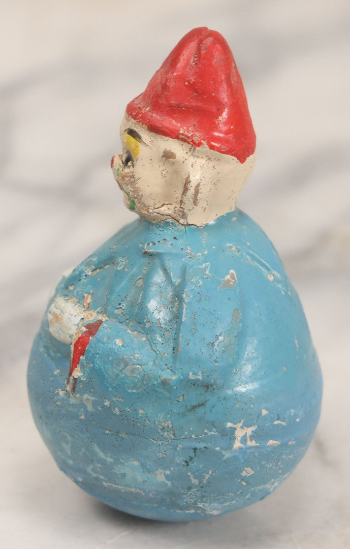 Lot 014 - Antique Papier Mache Clown Roly Poly Toy With Blue Body, Green And Yellow Makeup And Red Hat, Note Wear And Tear Throughout, Height 3-3/4"