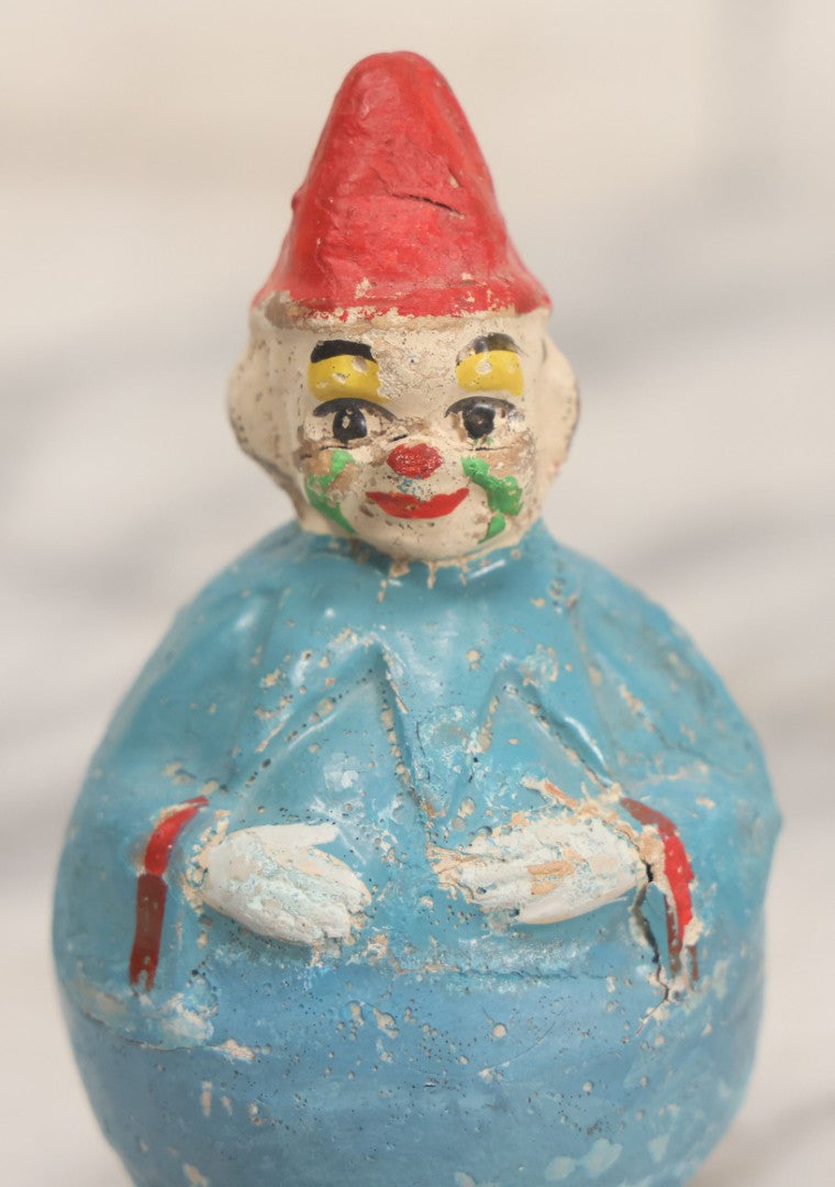 Lot 014 - Antique Papier Mache Clown Roly Poly Toy With Blue Body, Green And Yellow Makeup And Red Hat, Note Wear And Tear Throughout, Height 3-3/4"