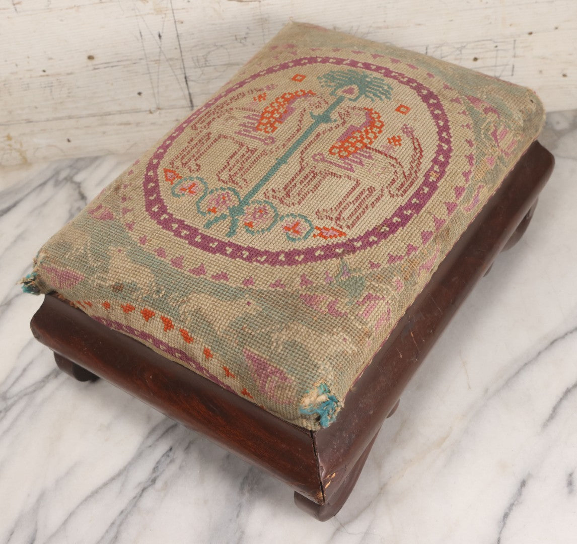 Lot 029 - Antique Victorian Wooden Footstool With Folk Art Needlepoint Seat Cover With Griffins And Tree Of Life Motif, Geometric Designs, Note Worn Corners 