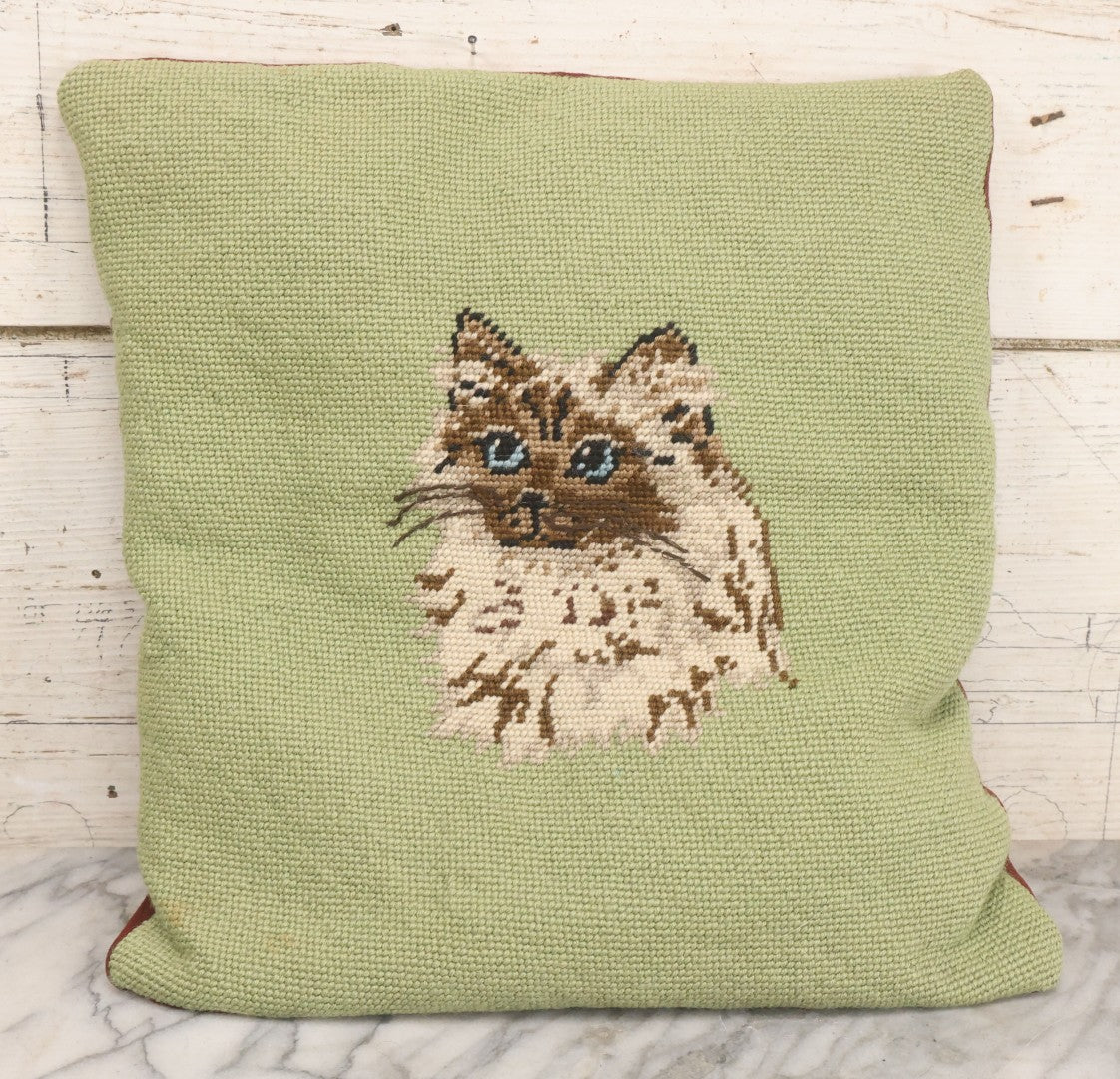 Lot 030 - Vintage Handmade Needlepoint Pillow With Fluffy Himalayan Cat On Green Background With Maroon Fabric Backing, 12" x 14"