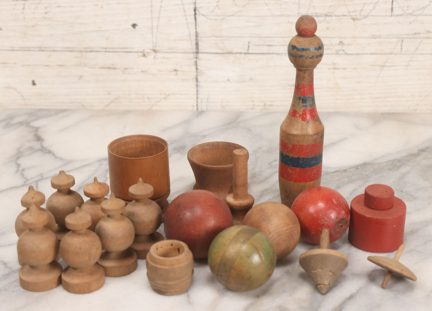 Lot 035 - Miscellaneous Grouping Of Vintage And Antique Carved Wooden Toys Including Balls, Cups, Game Pieces, And Tops, 15+ Pieces