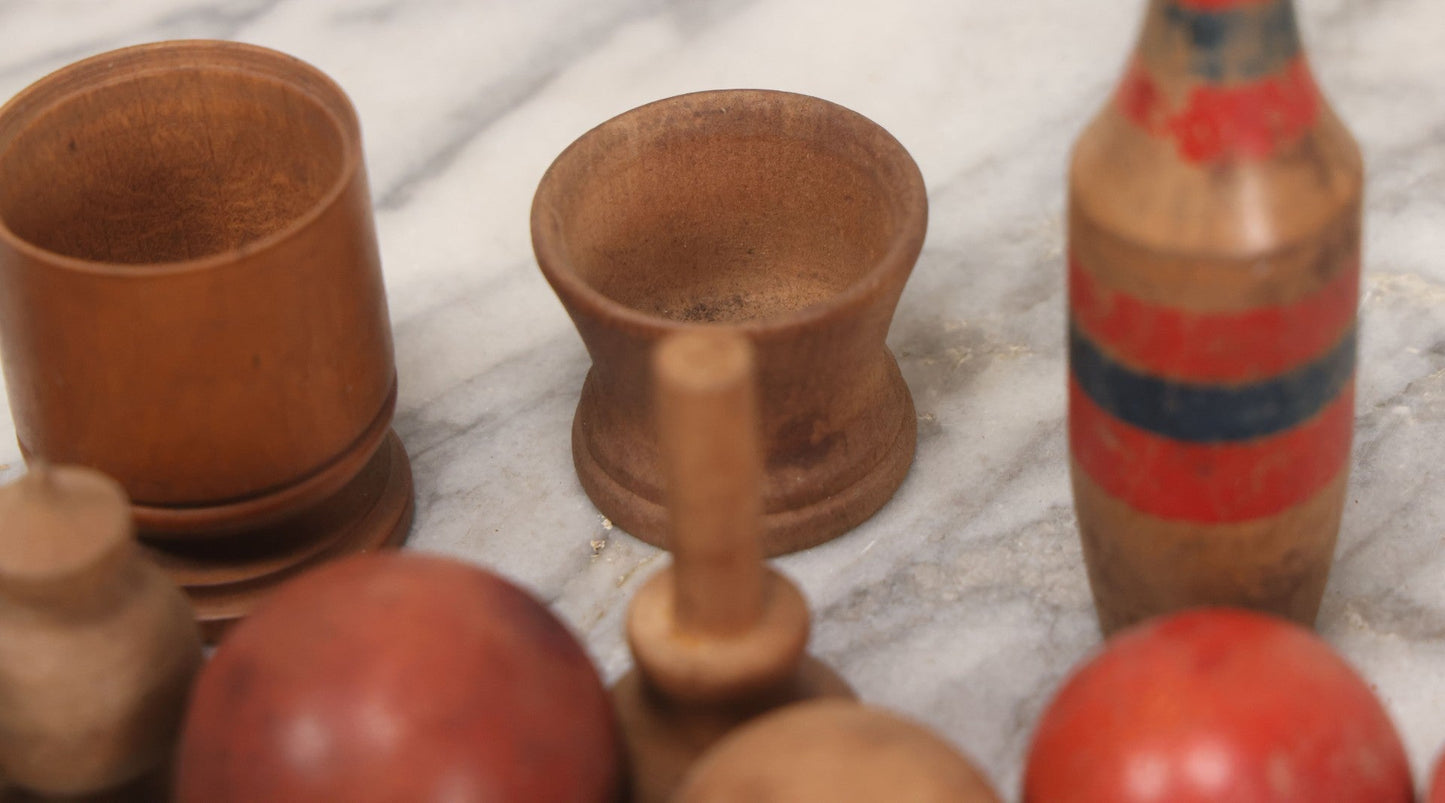 Lot 035 - Miscellaneous Grouping Of Vintage And Antique Carved Wooden Toys Including Balls, Cups, Game Pieces, And Tops, 15+ Pieces