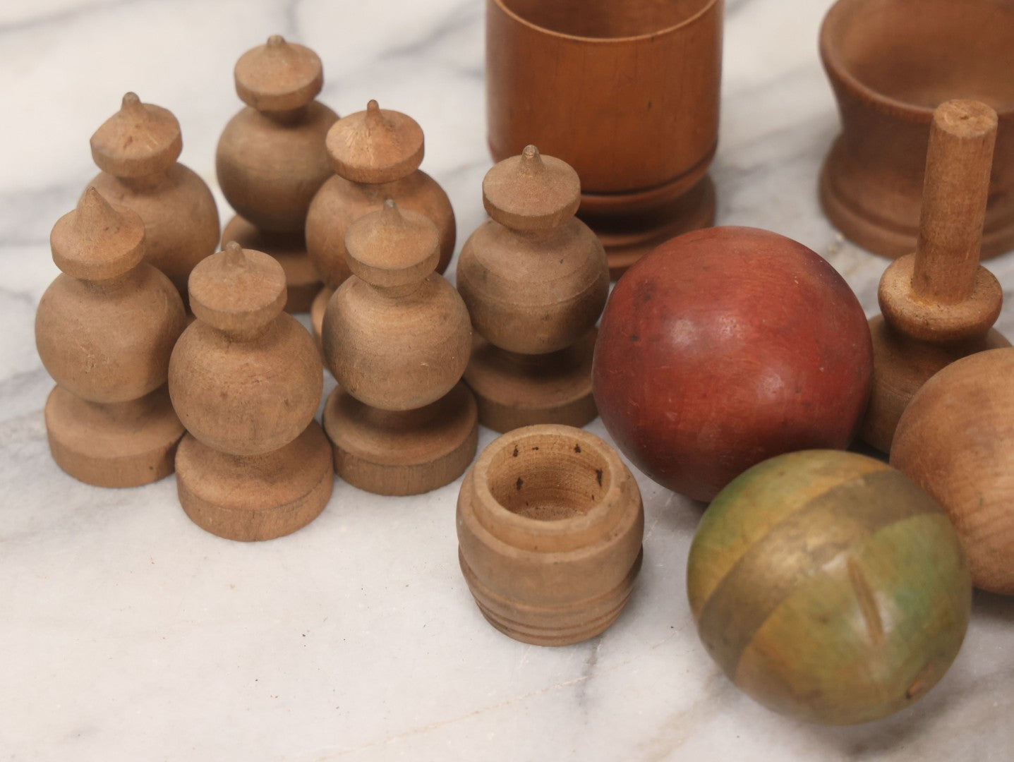 Lot 035 - Miscellaneous Grouping Of Vintage And Antique Carved Wooden Toys Including Balls, Cups, Game Pieces, And Tops, 15+ Pieces