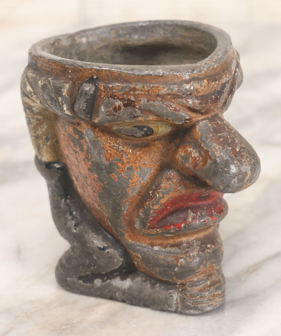 Lot 049 - Antique Cast Iron Comic Figural Match Holder With Original Paint, Man With Large Nose Flipping Legs Over Head, Note Worn Paint