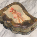 Lot 065 - Antique Victorian Celluloid Dresser Set Box With Woman In Extravagant Pink Coat, Winter Scene On Cover, Note Missing Contents, Various Wear And Tear To Cover