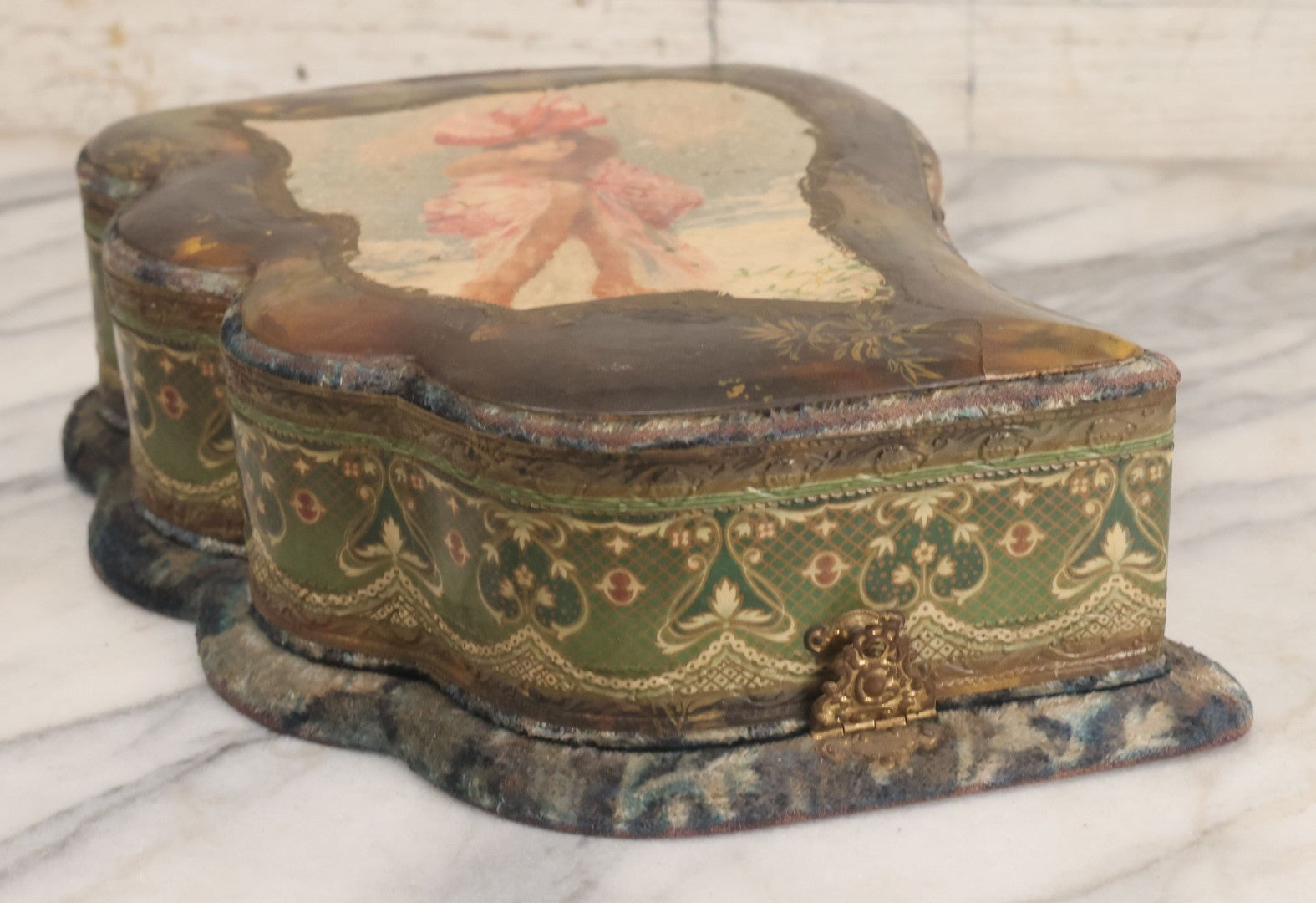 Lot 065 - Antique Victorian Celluloid Dresser Set Box With Woman In Extravagant Pink Coat, Winter Scene On Cover, Note Missing Contents, Various Wear And Tear To Cover