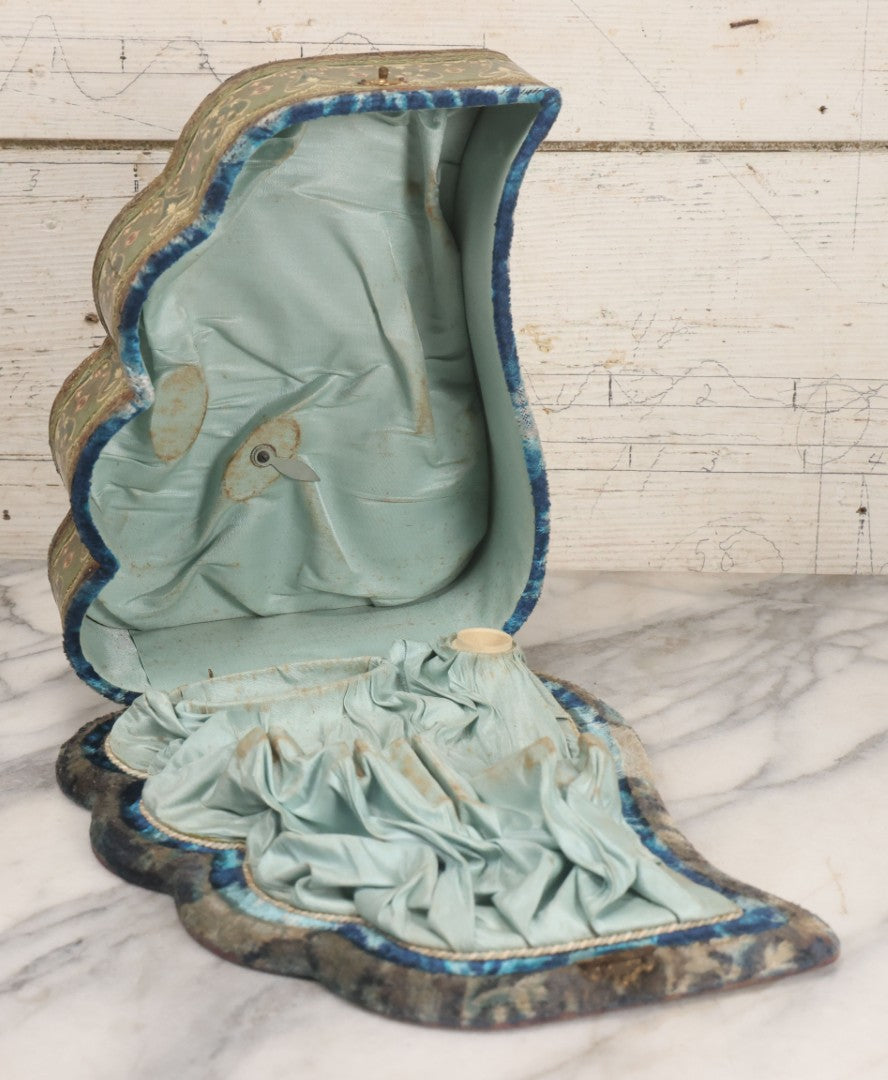 Lot 065 - Antique Victorian Celluloid Dresser Set Box With Woman In Extravagant Pink Coat, Winter Scene On Cover, Note Missing Contents, Various Wear And Tear To Cover