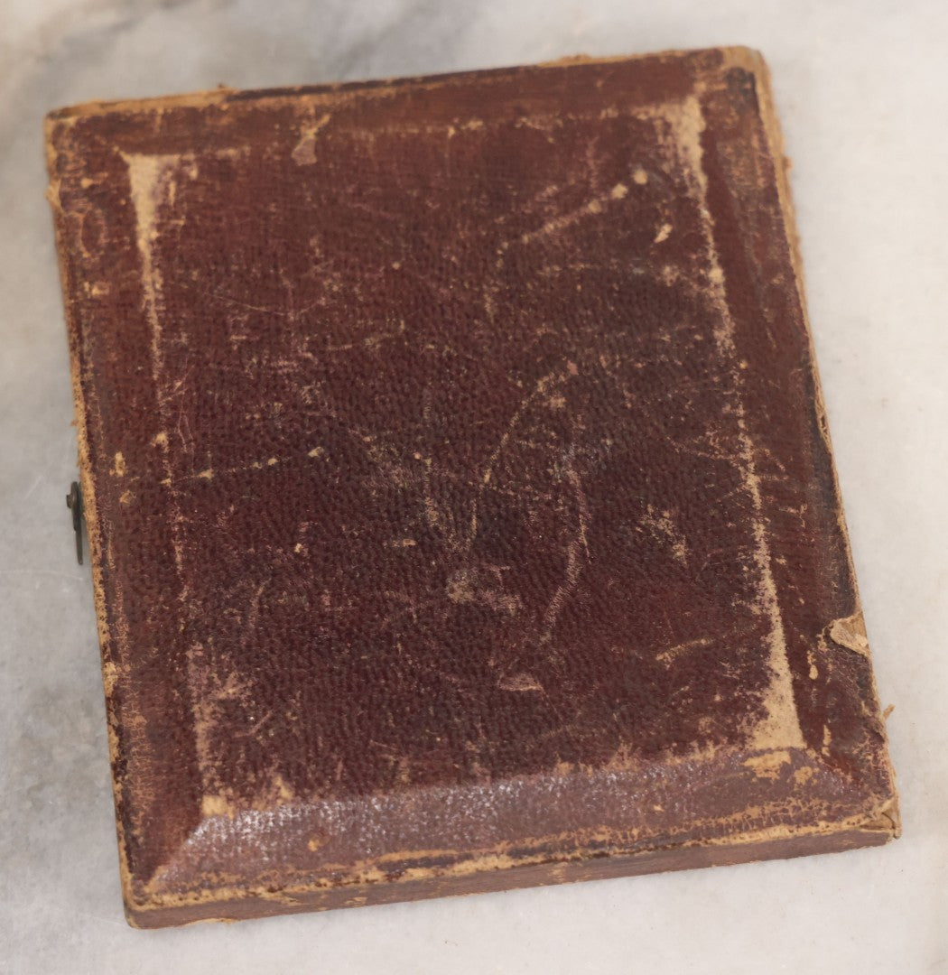 Lot 069 - Antique 1/6th Plate Daguerreotype Photograph Of Young Girl In Plaid Dress With Beaded Handbag Seated Beside A Table With Books In Half Leatherette Case