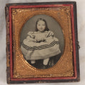 Lot 070 - Antique 1/6th Plate Ruby Ambrotype Photograph Of Smiling Little Girl With Red Tinted Cheeks, Curly Hair, Holding Books, Photograph Taken At Forbes New Gallery, Westfield, Massachusetts, In Half Leatherette Case