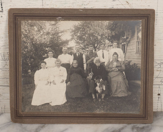 Lot 081 - Antique Boarded Photograph Of Family Gathering Including An Elderly Man Holding Border Collie Dog With American Flag