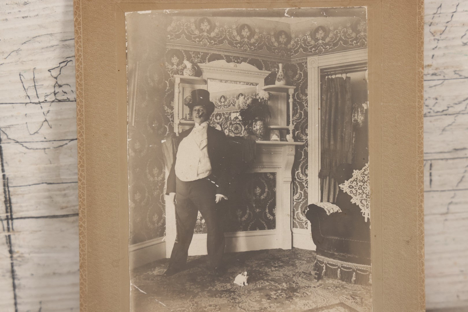 Lot 086 - Antique Boarded Interior Photograph Of Woman Dressed In Suit And Top Hat Smoking Cigar, With Handwritten Caption "Take A Little Bit Off The Top For Me" With Little Dog Figurine