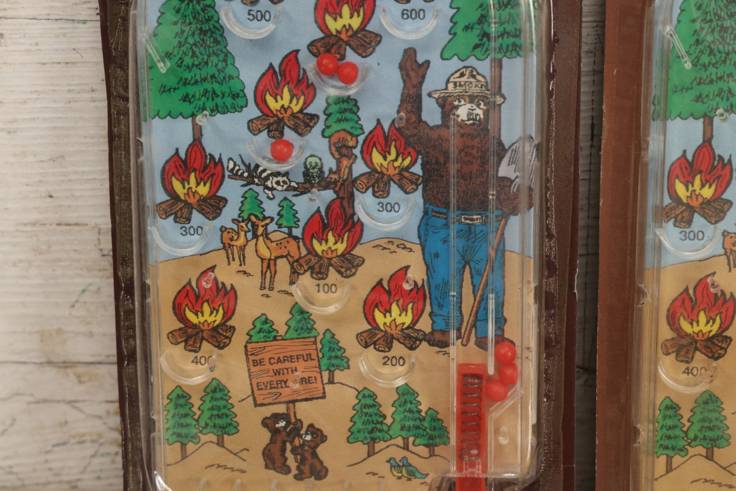 Lot 089 - Grouping Of Eight New Old Stock N.O.S. Smokey Bear "Put Out The Fires..." Pinball Game, Manufactured By Gordy International, Inc., Plainfield, New Jersey, No. 476, Made In China