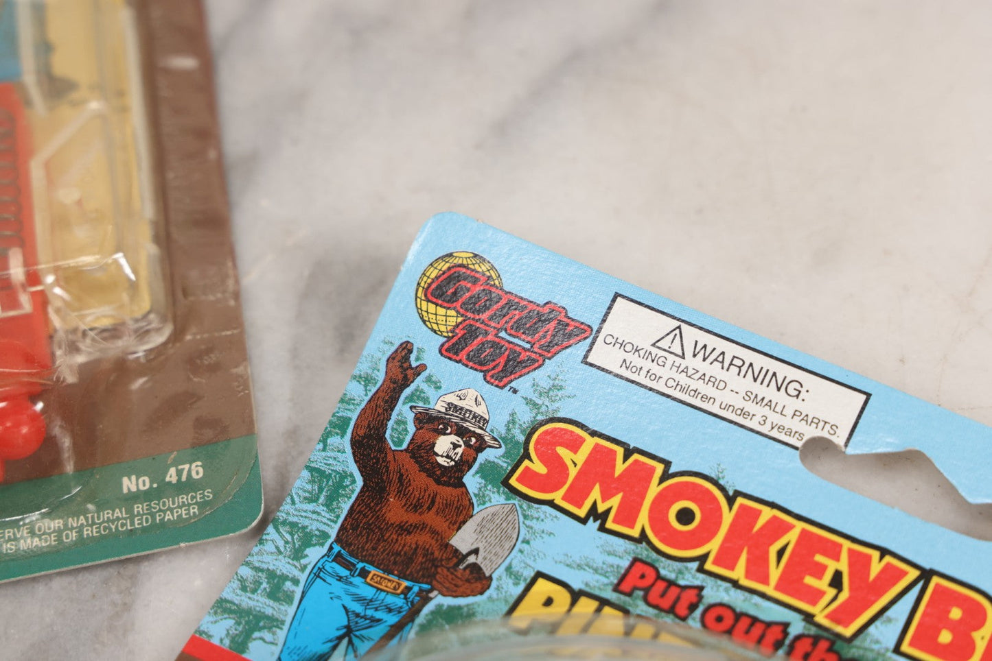 Lot 089 - Grouping Of Eight New Old Stock N.O.S. Smokey Bear "Put Out The Fires..." Pinball Game, Manufactured By Gordy International, Inc., Plainfield, New Jersey, No. 476, Made In China