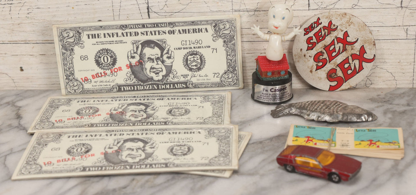 Lot 090 - Miscellaneous Novelties Grouping Including Casper The Friendly Ghost Push Button Puppet, Rusty Sex Pinback Button, Four "Inflated States Of America" Richard Nixon Dollars, Little Tacos 3D View Comic Book, Toy Sports Car, And Tin Fish