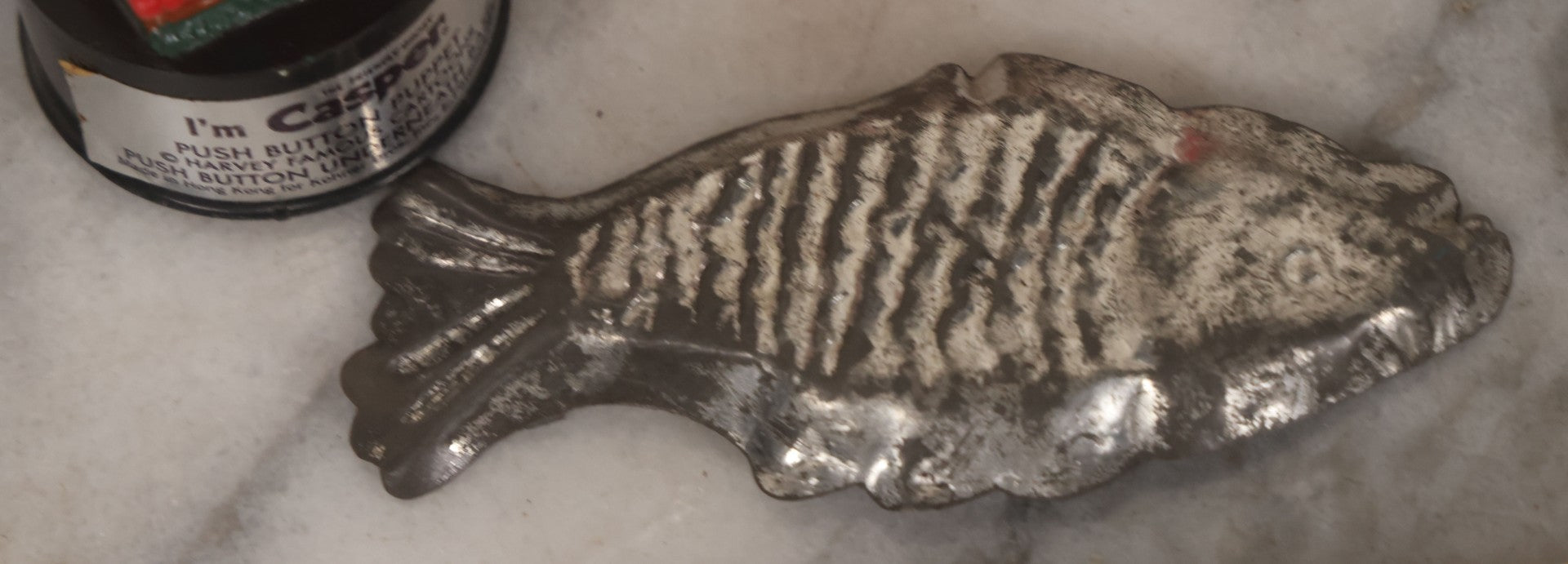 Lot 090 - Miscellaneous Novelties Grouping Including Casper The Friendly Ghost Push Button Puppet, Rusty Sex Pinback Button, Four "Inflated States Of America" Richard Nixon Dollars, Little Tacos 3D View Comic Book, Toy Sports Car, And Tin Fish