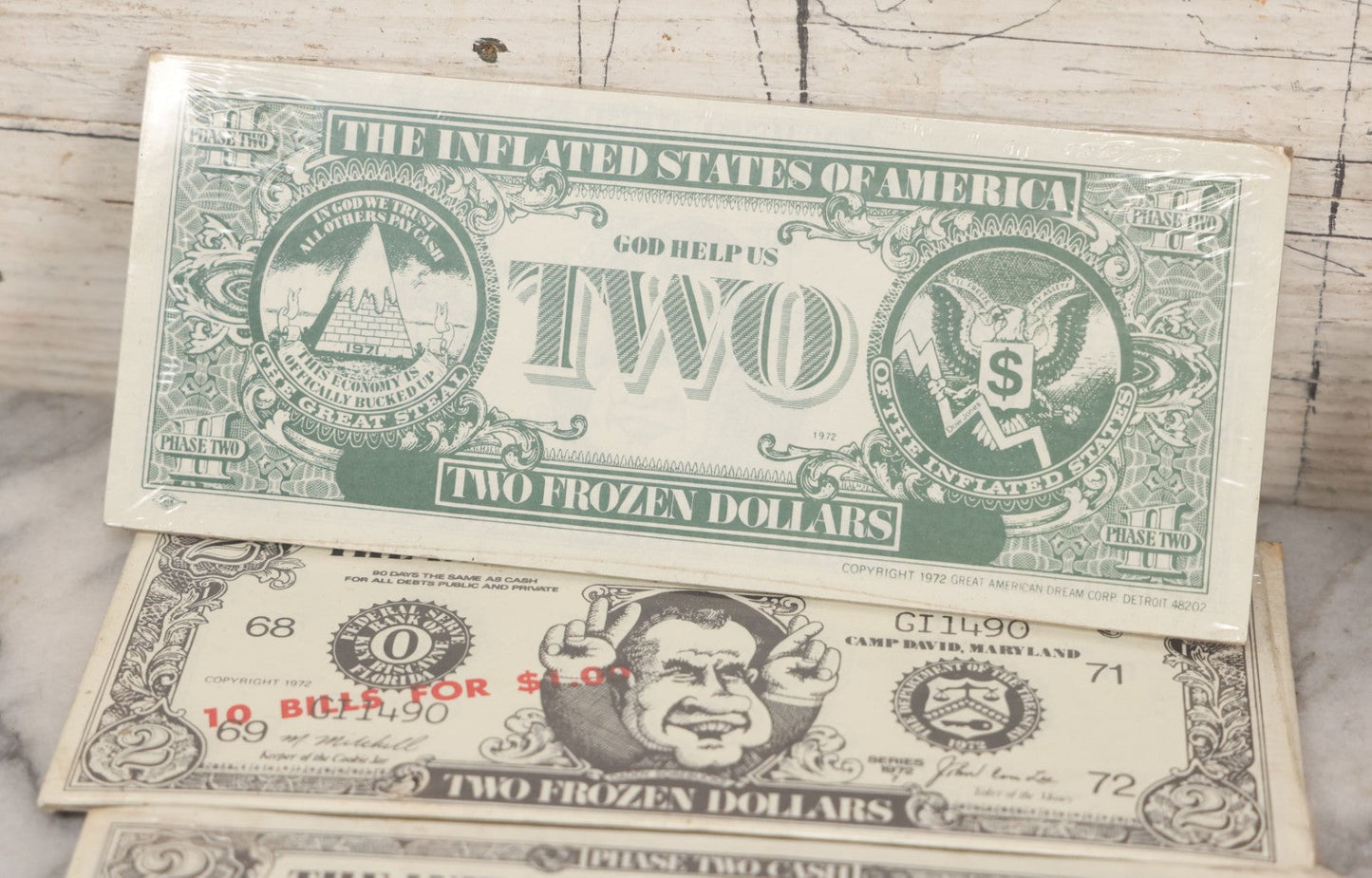 Lot 090 - Miscellaneous Novelties Grouping Including Casper The Friendly Ghost Push Button Puppet, Rusty Sex Pinback Button, Four "Inflated States Of America" Richard Nixon Dollars, Little Tacos 3D View Comic Book, Toy Sports Car, And Tin Fish