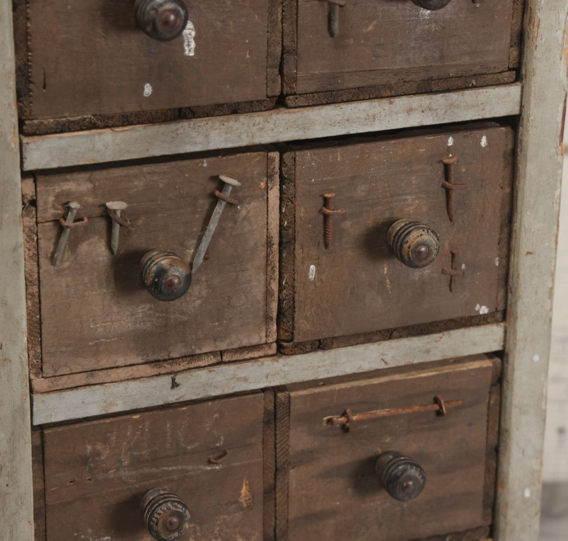 Lot 003 - Antique Make-Do 12-Drawer Nail And Hardware Bin With Drawers Made Out Of Old Cheese Boxes With Wooden Knobs, Many Drawers Divided, With Identifying Sample Nails Stapled To Front, Empty