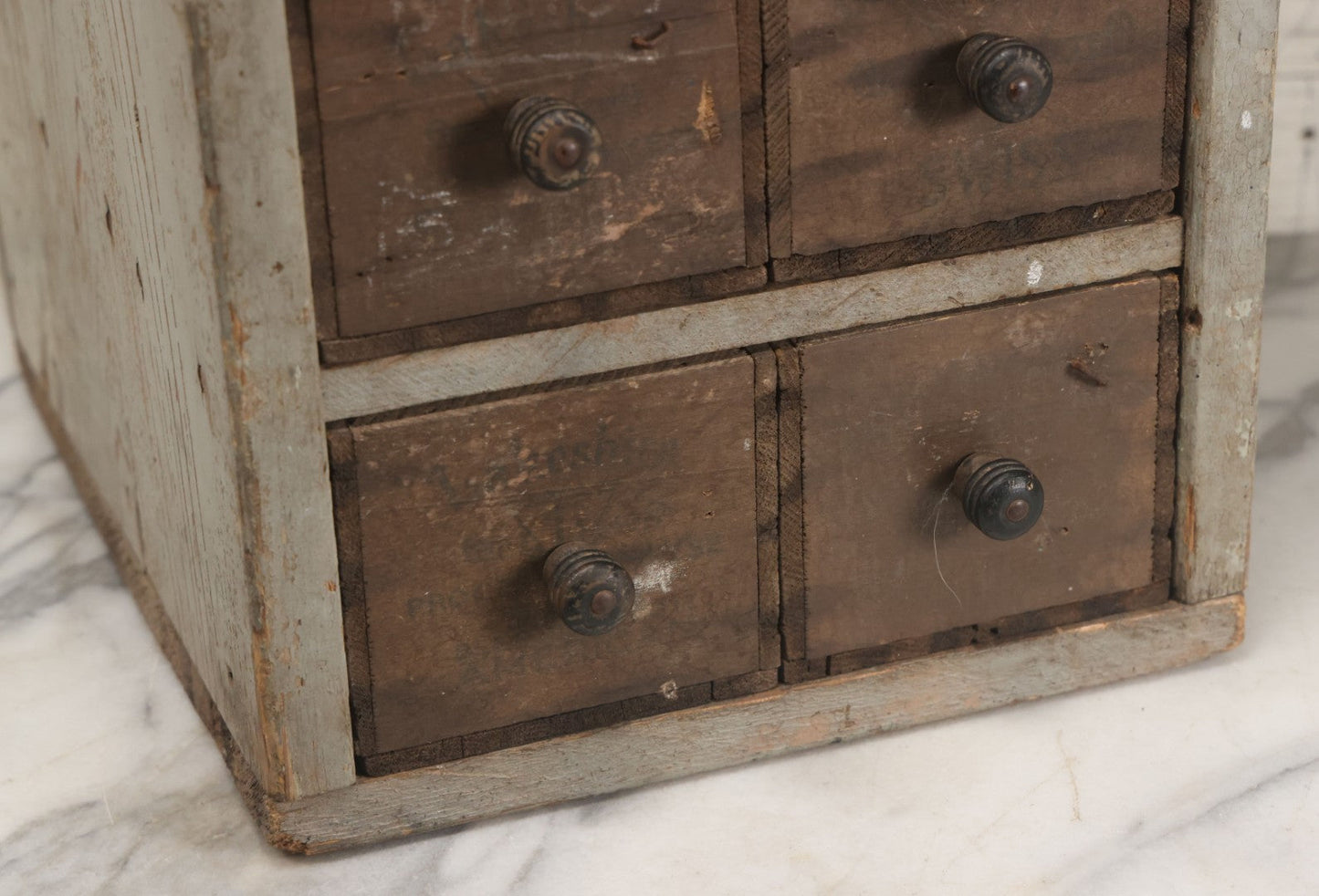 Lot 003 - Antique Make-Do 12-Drawer Nail And Hardware Bin With Drawers Made Out Of Old Cheese Boxes With Wooden Knobs, Many Drawers Divided, With Identifying Sample Nails Stapled To Front, Empty
