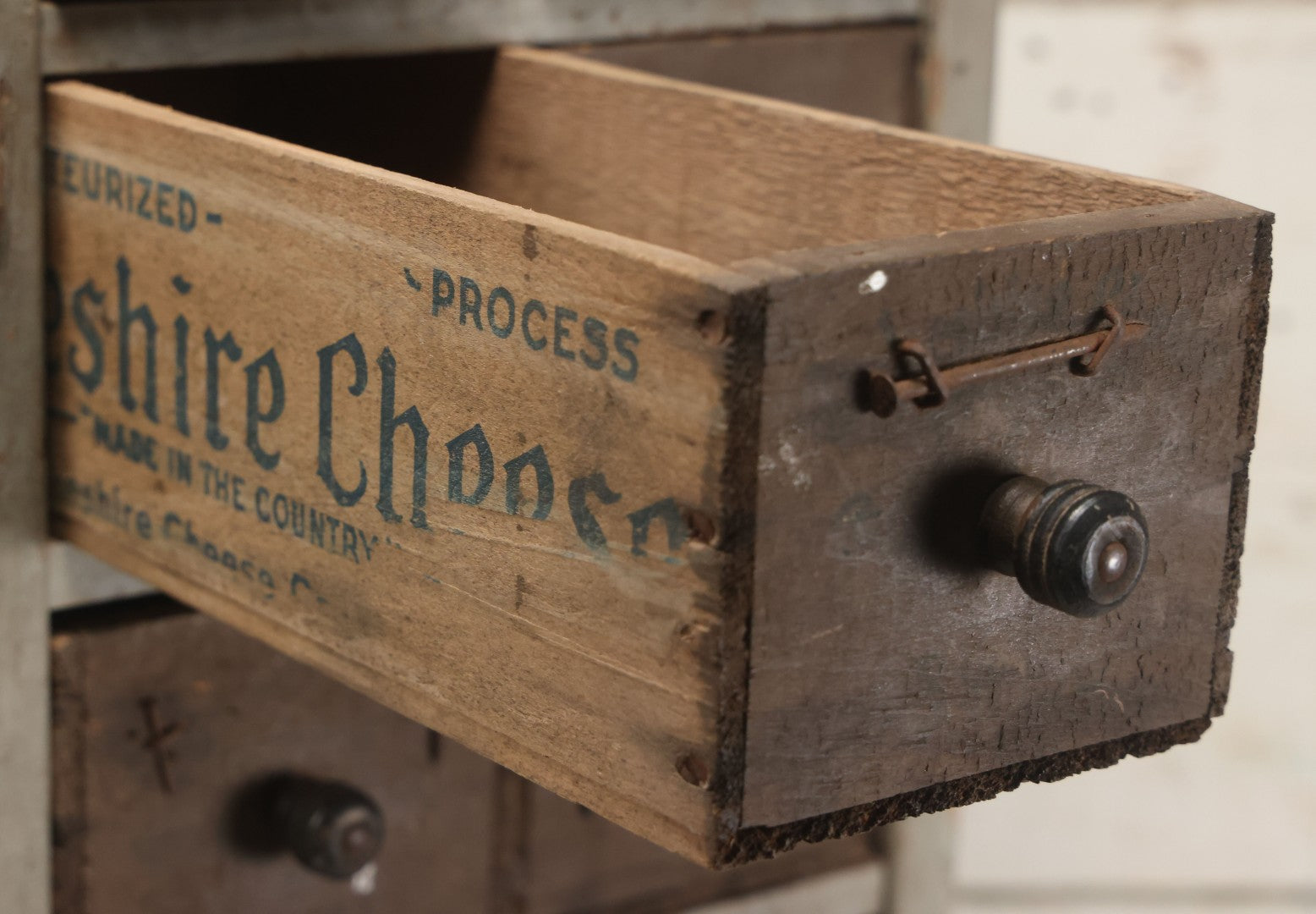 Lot 003 - Antique Make-Do 12-Drawer Nail And Hardware Bin With Drawers Made Out Of Old Cheese Boxes With Wooden Knobs, Many Drawers Divided, With Identifying Sample Nails Stapled To Front, Empty