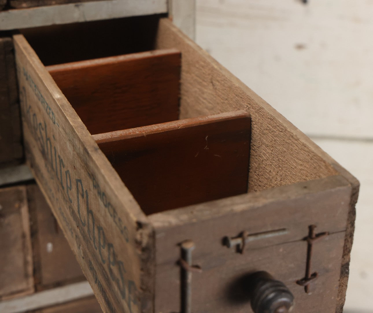 Lot 003 - Antique Make-Do 12-Drawer Nail And Hardware Bin With Drawers Made Out Of Old Cheese Boxes With Wooden Knobs, Many Drawers Divided, With Identifying Sample Nails Stapled To Front, Empty