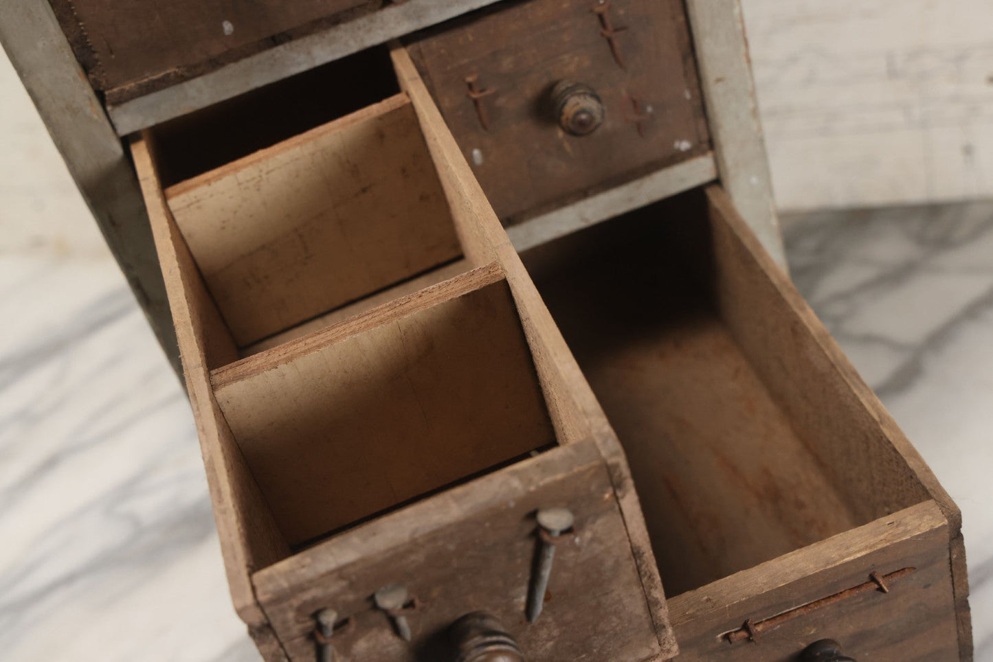 Lot 003 - Antique Make-Do 12-Drawer Nail And Hardware Bin With Drawers Made Out Of Old Cheese Boxes With Wooden Knobs, Many Drawers Divided, With Identifying Sample Nails Stapled To Front, Empty