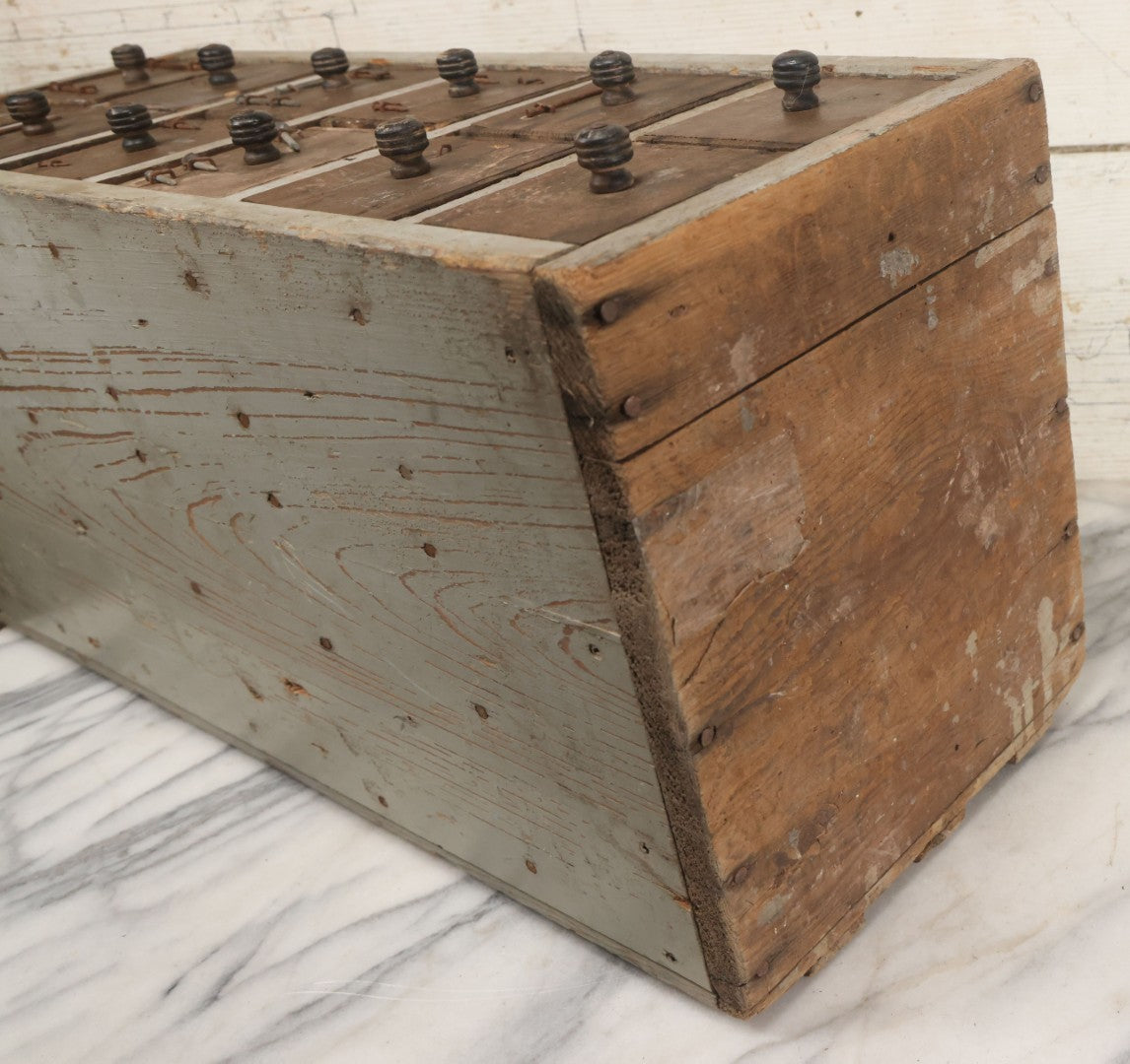 Lot 003 - Antique Make-Do 12-Drawer Nail And Hardware Bin With Drawers Made Out Of Old Cheese Boxes With Wooden Knobs, Many Drawers Divided, With Identifying Sample Nails Stapled To Front, Empty