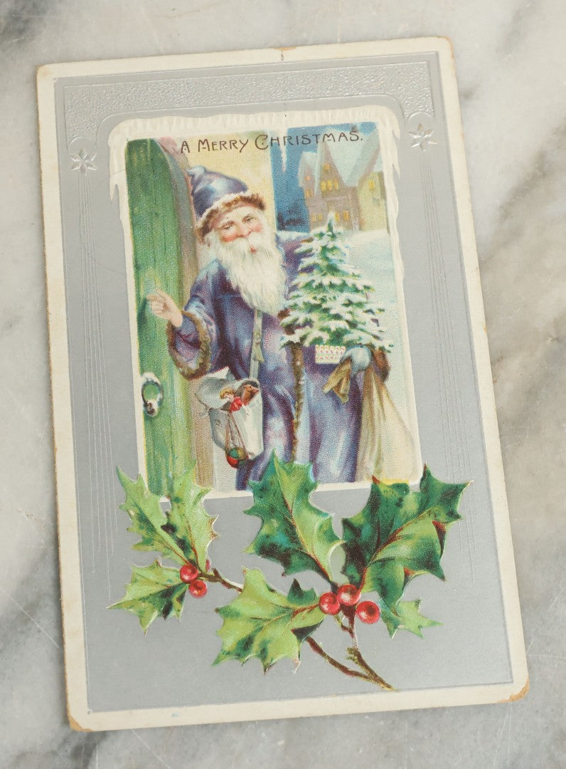 Lot 098 - Single Antique Christmas Postcard With Santa Claus In Blue Robes Knocking On Door With Presents, Postmarked 1909