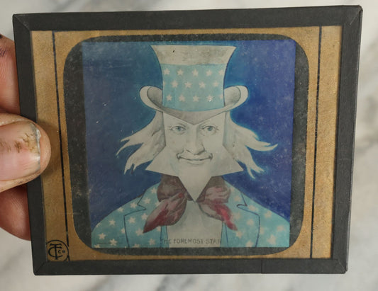 Lot 101 - Antique Hand Colored Magic Lantern Slide Of Uncle Sam, Titled "The Foremost Star," Copyright 1898