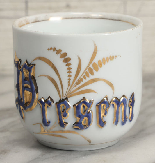 Lot 130 - Antique Porcelain Mug With Blue And Gold "Present" Decoration, Makers Mark On Bottom