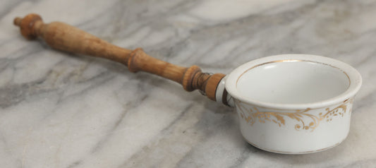 Lot 132 - Vintage Porcelain Tea Strainer With Gold Painted Details And Wire Attached Wooden Handle, Note Repairs